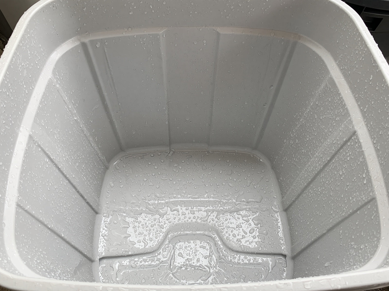 Sanitized trash cart interior after wash and degrease